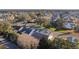 Aerial view of a quiet neighborhood with mature trees and well-maintained homes in a peaceful setting at 2507 Caribe Dr, The Villages, FL 32162