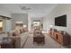 Bright living room with hardwood floors, comfortable seating, and lots of natural light at 2507 Caribe Dr, The Villages, FL 32162