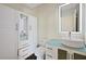 Modern bathroom with a vessel sink, lighted mirror, and ample storage at 30138 Losino Cv, Mount Dora, FL 32757
