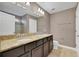 Bathroom with double vanity, granite countertop, and separate shower and tub at 30138 Losino Cv, Mount Dora, FL 32757