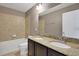 Bathroom with double vanity, granite countertop, and tub shower combo at 30138 Losino Cv, Mount Dora, FL 32757