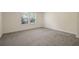 Bright bedroom with large windows and carpet at 30138 Losino Cv, Mount Dora, FL 32757