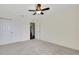 Spacious bedroom with double doors and carpet at 30138 Losino Cv, Mount Dora, FL 32757