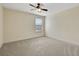 Well-lit bedroom with a ceiling fan and carpet at 30138 Losino Cv, Mount Dora, FL 32757