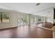 Bright dining room with wood floors and sliding glass doors leading to the backyard at 30138 Losino Cv, Mount Dora, FL 32757
