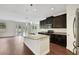 Modern kitchen with stainless steel appliances and granite counters at 30138 Losino Cv, Mount Dora, FL 32757