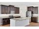 Modern kitchen with stainless steel appliances and granite counters at 30138 Losino Cv, Mount Dora, FL 32757
