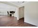 Open living room with hardwood floors and access to kitchen at 30138 Losino Cv, Mount Dora, FL 32757