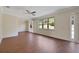 Spacious living room with hardwood floors and large windows at 30138 Losino Cv, Mount Dora, FL 32757