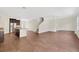 Open living area with hardwood floors and kitchen views at 30138 Losino Cv, Mount Dora, FL 32757