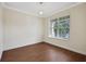 Bright office with wood floors, large window, and neutral walls at 30138 Losino Cv, Mount Dora, FL 32757