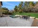 Inviting pool with patio furniture and lush landscaping at 30138 Losino Cv, Mount Dora, FL 32757