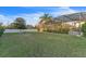Spacious backyard with screened enclosure at 3463 Creek Run Ln, Eustis, FL 32736