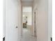 Clean bathroom hallway with tiled floor and neutral tones at 3463 Creek Run Ln, Eustis, FL 32736