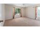 Well-lit bedroom with ample carpet space and window coverings at 3463 Creek Run Ln, Eustis, FL 32736