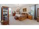 Spacious main bedroom with ample light and built-in shelving at 3463 Creek Run Ln, Eustis, FL 32736