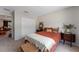 Bright bedroom with orange bedding and ensuite bathroom at 3463 Creek Run Ln, Eustis, FL 32736