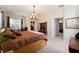 King bed, en-suite bathroom access, and plenty of natural light at 3463 Creek Run Ln, Eustis, FL 32736