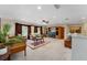 Spacious bonus room featuring a cozy sitting area and built-in entertainment center at 3463 Creek Run Ln, Eustis, FL 32736