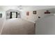 Large bonus room with gray carpet and ceiling fan at 3463 Creek Run Ln, Eustis, FL 32736