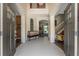 Spacious foyer with tile flooring, a bench, and views to living areas at 3463 Creek Run Ln, Eustis, FL 32736