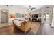 Living room featuring hardwood floors, comfortable seating, and views to other rooms at 3463 Creek Run Ln, Eustis, FL 32736