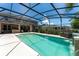 Inviting screened-in pool with spa and a covered patio area at 3463 Creek Run Ln, Eustis, FL 32736