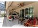 Covered patio area overlooking the pool with comfortable seating at 3463 Creek Run Ln, Eustis, FL 32736