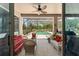 Relaxing screened-in pool area with patio furniture and lush landscaping at 3463 Creek Run Ln, Eustis, FL 32736