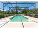 Inviting screened pool with waterfall feature at 3463 Creek Run Ln, Eustis, FL 32736