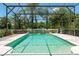 Refreshing screened pool with a waterfall feature at 3463 Creek Run Ln, Eustis, FL 32736