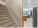 Carpeted staircase leading to the second floor at 3463 Creek Run Ln, Eustis, FL 32736