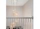Elegant staircase with crystal chandelier at 3463 Creek Run Ln, Eustis, FL 32736