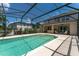 Screened-in swimming pool with a large patio area at 3463 Creek Run Ln, Eustis, FL 32736