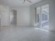 Open living space with tile floors and access to a patio at 409 Glen Arbor Ln, Leesburg, FL 34748