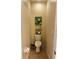 Small half bathroom with toilet and shelving unit at 4813 Waters Gate Dr, Tavares, FL 32778