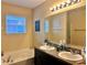 Double vanity bathroom with soaking tub and walk-in shower at 4813 Waters Gate Dr, Tavares, FL 32778