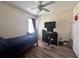 Bedroom with a bed, gaming setup, and ample floor space at 4813 Waters Gate Dr, Tavares, FL 32778