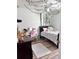 Bedroom with a bed, desk, and decorative wall hangings at 4813 Waters Gate Dr, Tavares, FL 32778