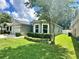 House exterior with a neatly trimmed lawn at 4813 Waters Gate Dr, Tavares, FL 32778