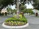 Gated entrance to a community with lush landscaping at 4813 Waters Gate Dr, Tavares, FL 32778