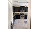 Kitchen with dark cabinets, stainless steel appliances, and tile floors at 4813 Waters Gate Dr, Tavares, FL 32778