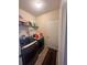 Laundry room with washer, dryer, and shelving at 4813 Waters Gate Dr, Tavares, FL 32778