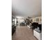 Open living room and dining area with tile floors at 4813 Waters Gate Dr, Tavares, FL 32778