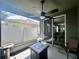 Screened porch with fire pit, seating, and backyard view at 4813 Waters Gate Dr, Tavares, FL 32778