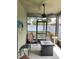 Relaxing screened porch with fire pit and seating at 4813 Waters Gate Dr, Tavares, FL 32778