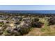 Community view with lake, golf course and homes at 5312 Meadow Hill Loop, Lady Lake, FL 32159