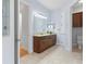 Elegant bathroom with double vanity and tile flooring at 5312 Meadow Hill Loop, Lady Lake, FL 32159