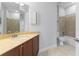 Bathroom with tub, toilet, and vanity at 5312 Meadow Hill Loop, Lady Lake, FL 32159