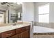 Bathroom with soaking tub, shower, and modern vanity at 5312 Meadow Hill Loop, Lady Lake, FL 32159